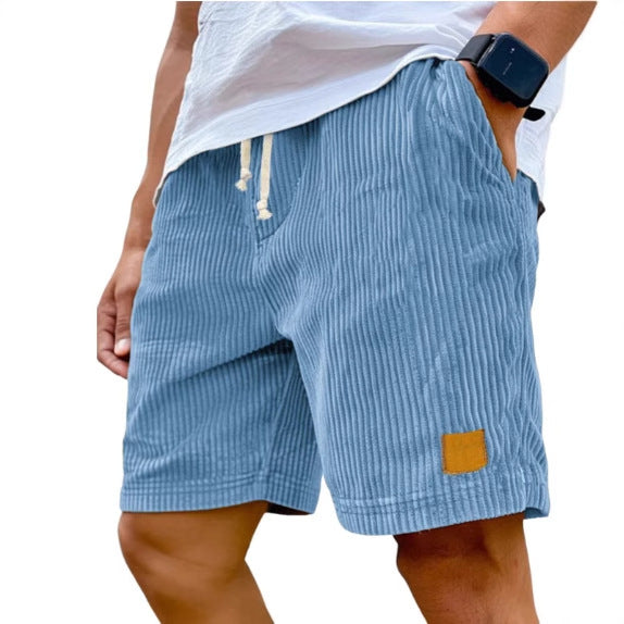 Blue striped shorts worn by a person on a white background